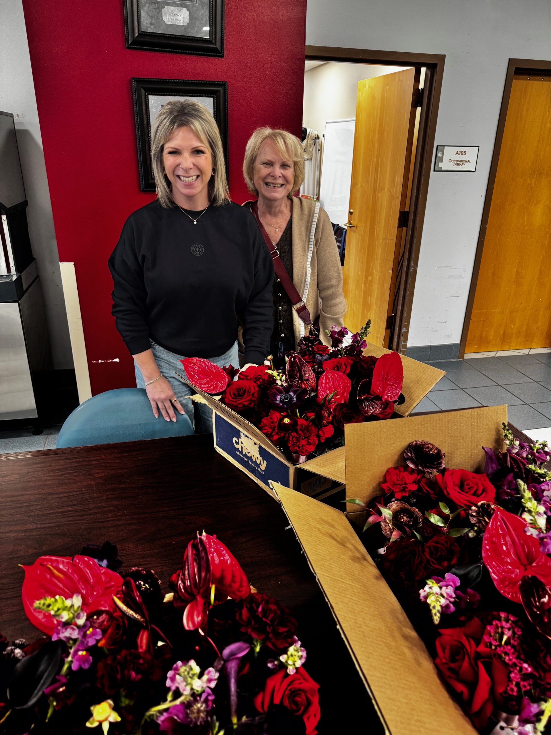 Volunteers arranging donated flowers