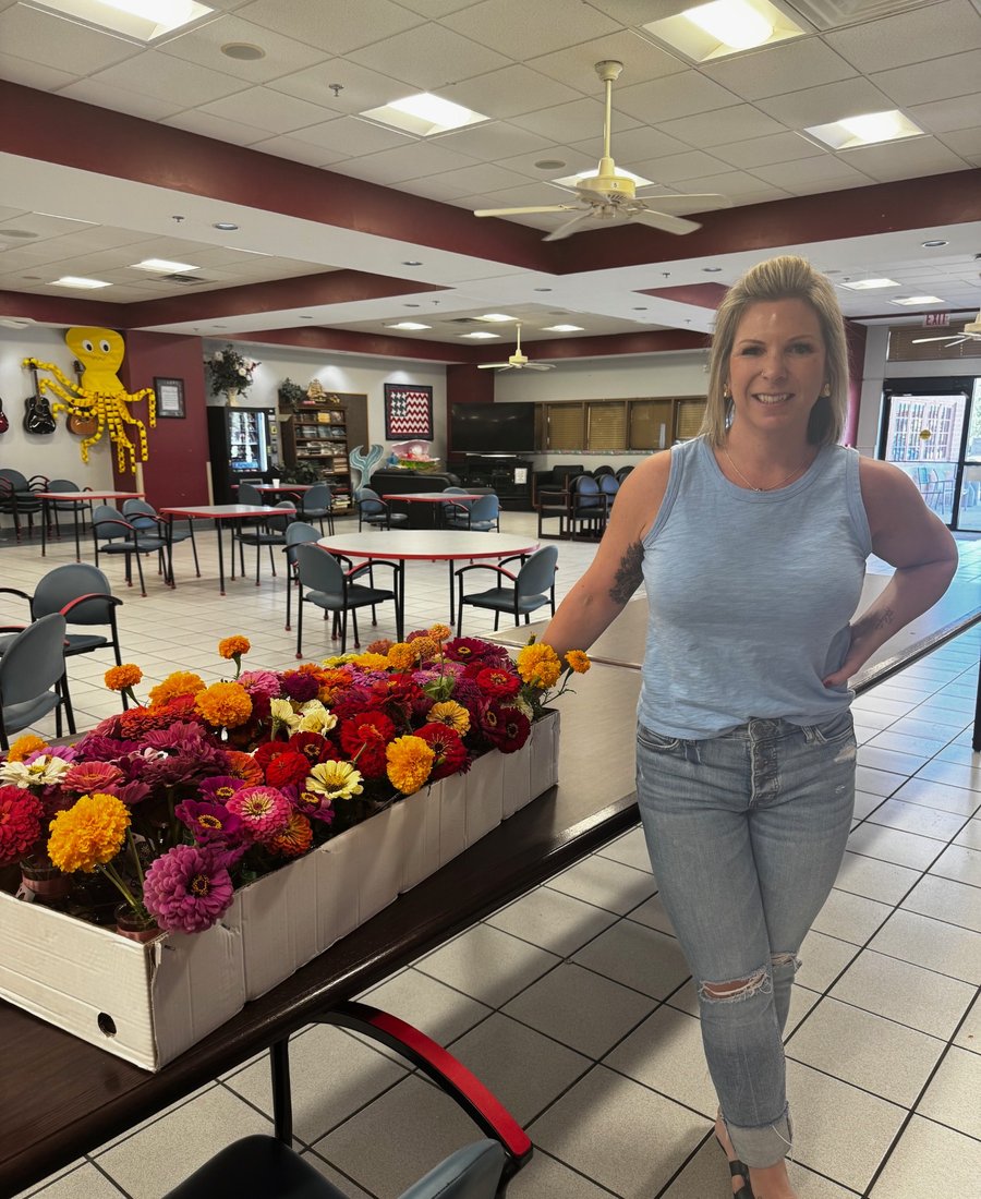 Petals of Light founder with bouquets