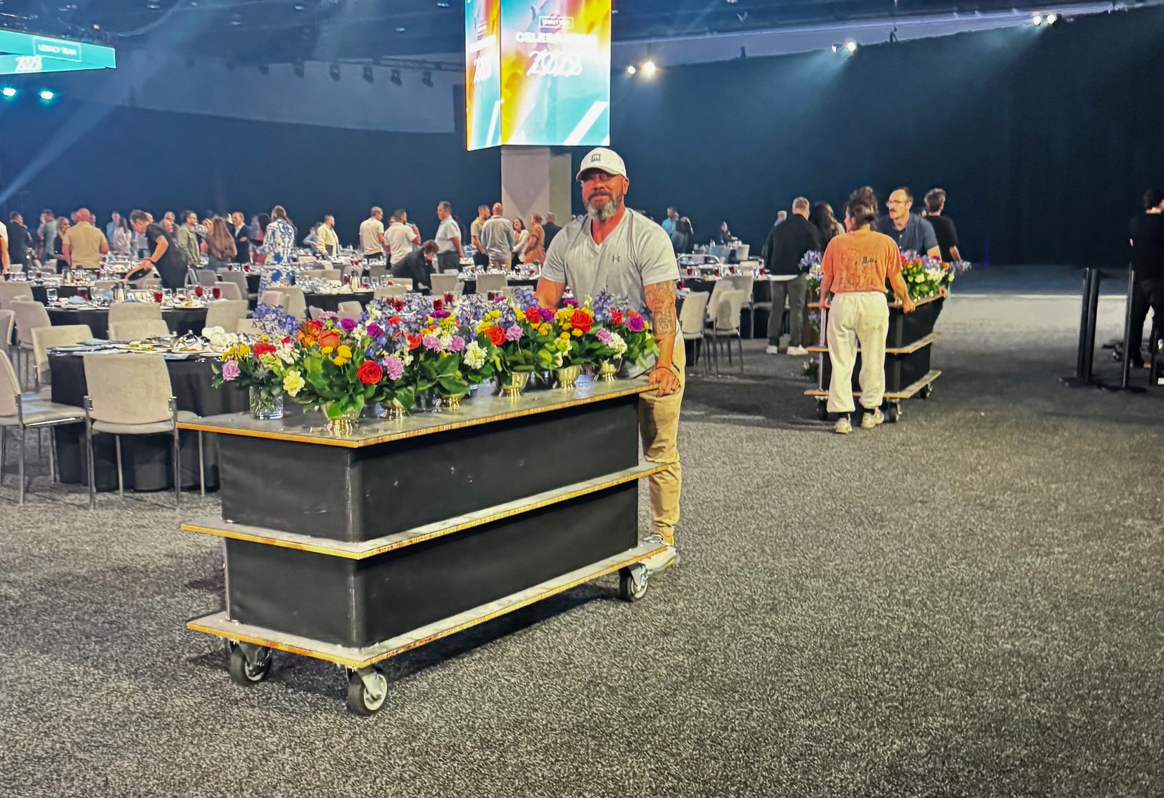 Volunteers collecting flowers from event
